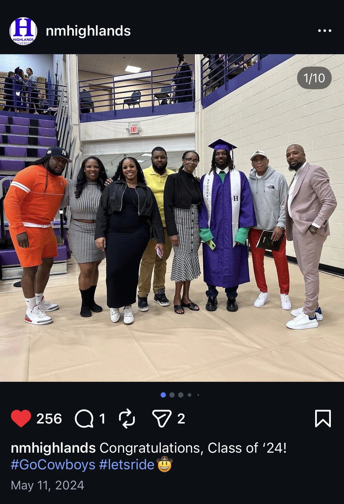 Graduate with family at commencement 2024